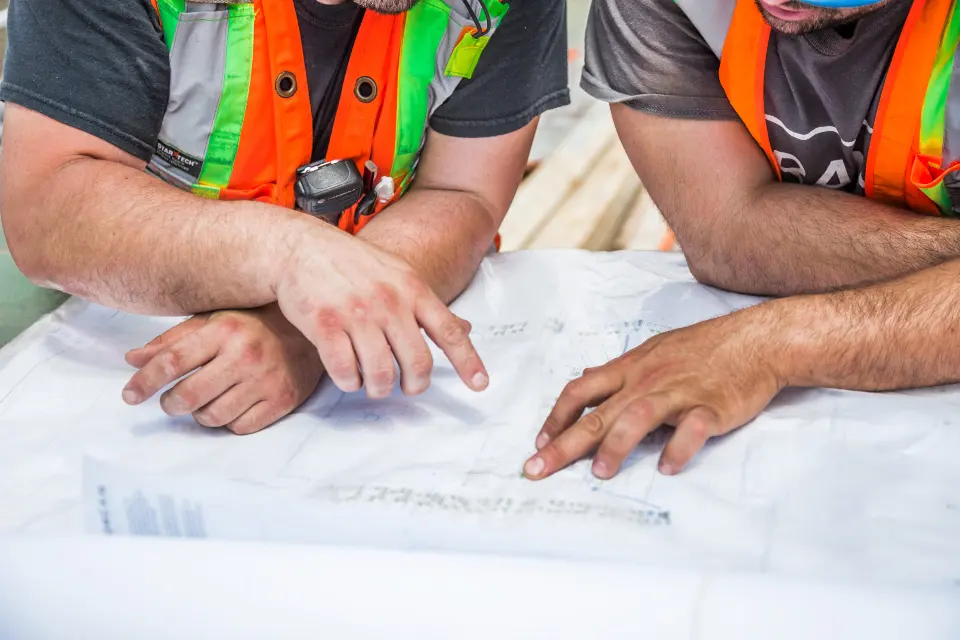 Reviewing project plans on site